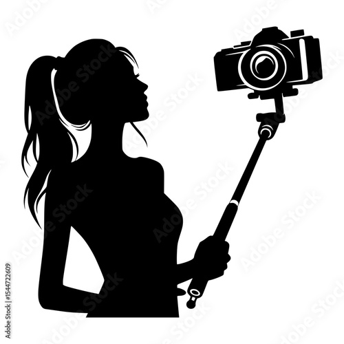 Woman silhouette taking selfie with camera on stick