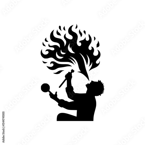 Silhouette of a glassblower blowing fire
