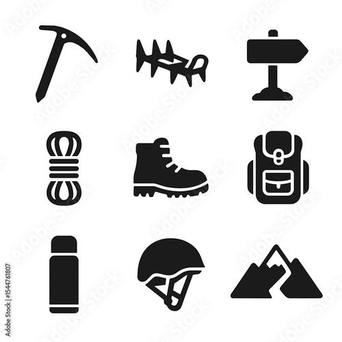 Alpine Adventure Icons. Solid, filled icons set of alpine adventures: ice axe, crampons, rope coil, summit