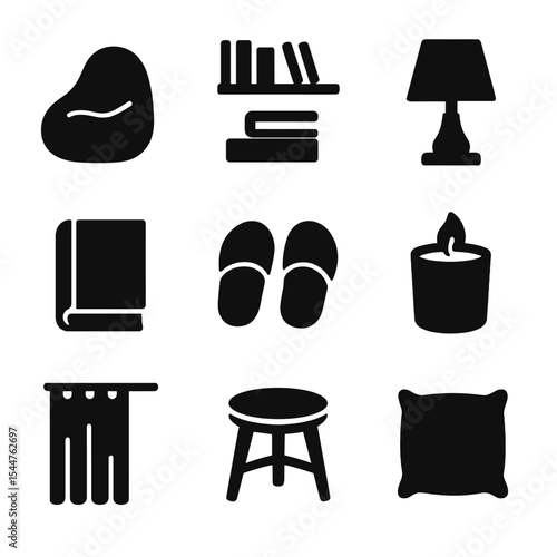 Book Lover's Icons. Solid, filled icons set of book lover's corner: bean bag chair, wall shelves, table lamp,