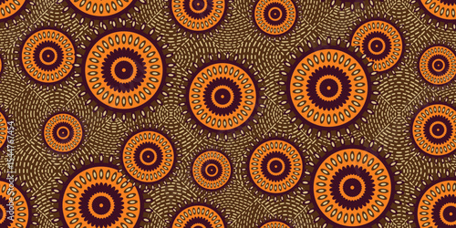 African ethnic traditional orange and brown pattern. seamless beautiful Kitenge, chitenge style. fashion design in colorful. Geometric circle abstract motif. Floral Ankara prints, African wax prints.