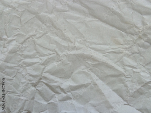 the texture of crumpled gray paper in close-up.