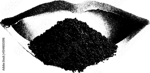 Spilled coffee grounds on paper in high contrast black and white