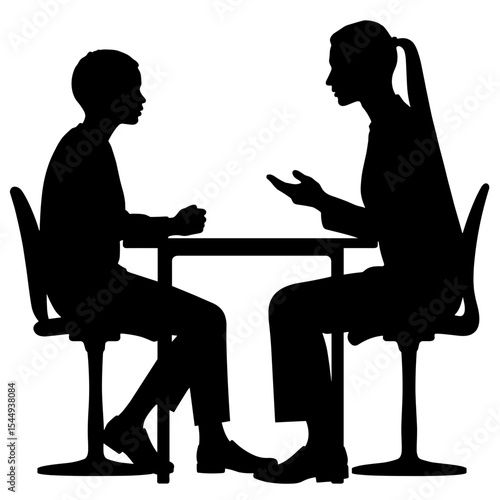 Silhouette of counselor and teen talking across desk, one-on-one guidance session