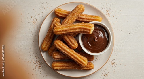 Delicious churros with chocolate dipping sauce, a classic dessert delight