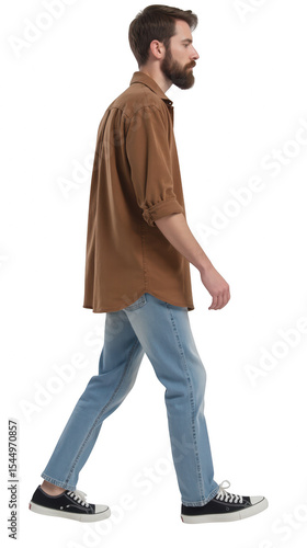 Man walking in casual outfit featuring brown shirt and light blue jeans, exuding relaxed vibe