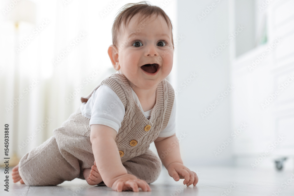 Cute little baby crawling on floor at home Cute little baby crawling on floor at home