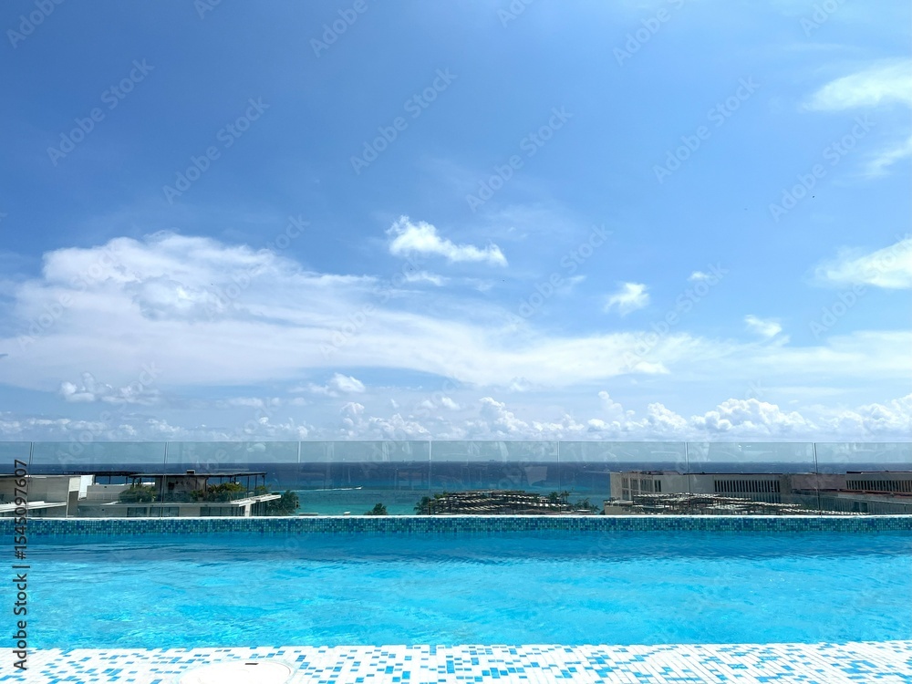Fototapeta premium Infinity Pool Blending into Ocean Horizon