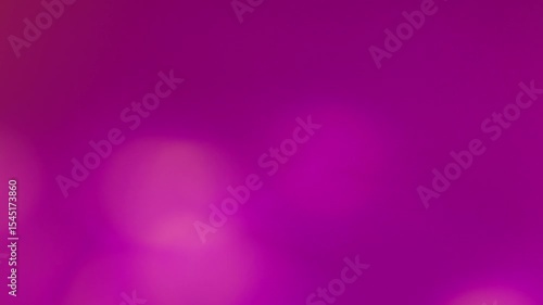 Blurred abstract video of a music concert stage with vibrant pink and magenta lighting effects. Defocused lights create a dreamy, energetic party and nightlife atmosphere. Real time 4K Video.