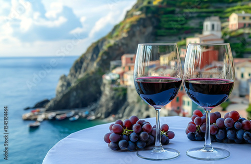Red Wine Glasses and Grapes Overlooking Scilla Village