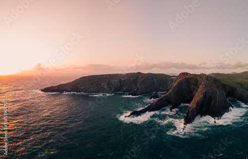 A Stunning Coastal Landscape Captured at Sunset Featuring Rocky Outcrops