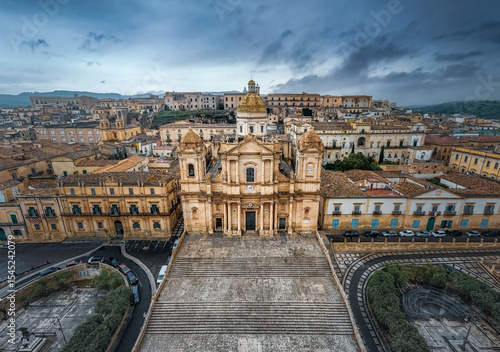 Cattedrale di San Nicolo ancient catholic cathedral and Palazzo Ducezio on cloudy day, Noto, Italy
