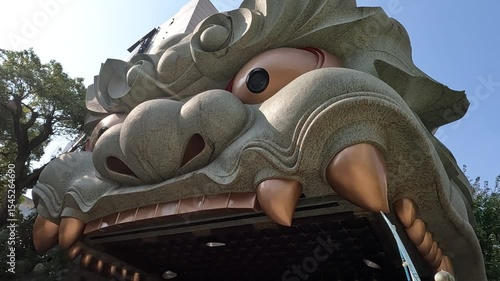 A giant temple with a mother and son praying during the day