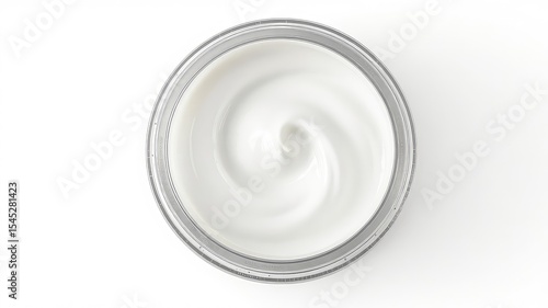 Top down view of a clear jar filled with smooth, creamy white substance on a white background