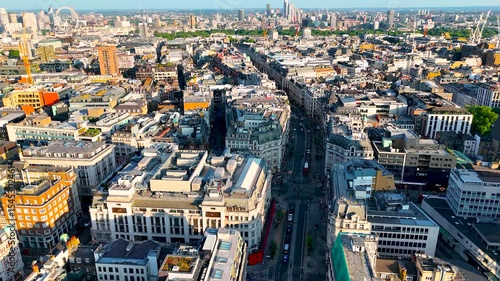 High-angle aerial shot of Regent Street, London’s iconic shopping and business avenue, with curved facades, traffic, and city activity. Ideal for travel, retail, and urban business projects.