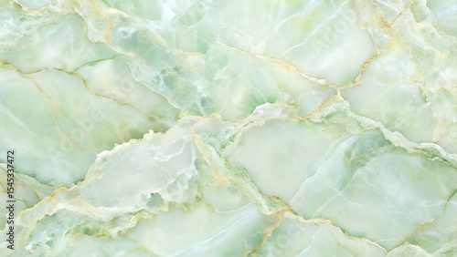 Close-up view of pale green onyx marble texture with gold veining, showcasing its luxurious and elegant natural stone pattern.