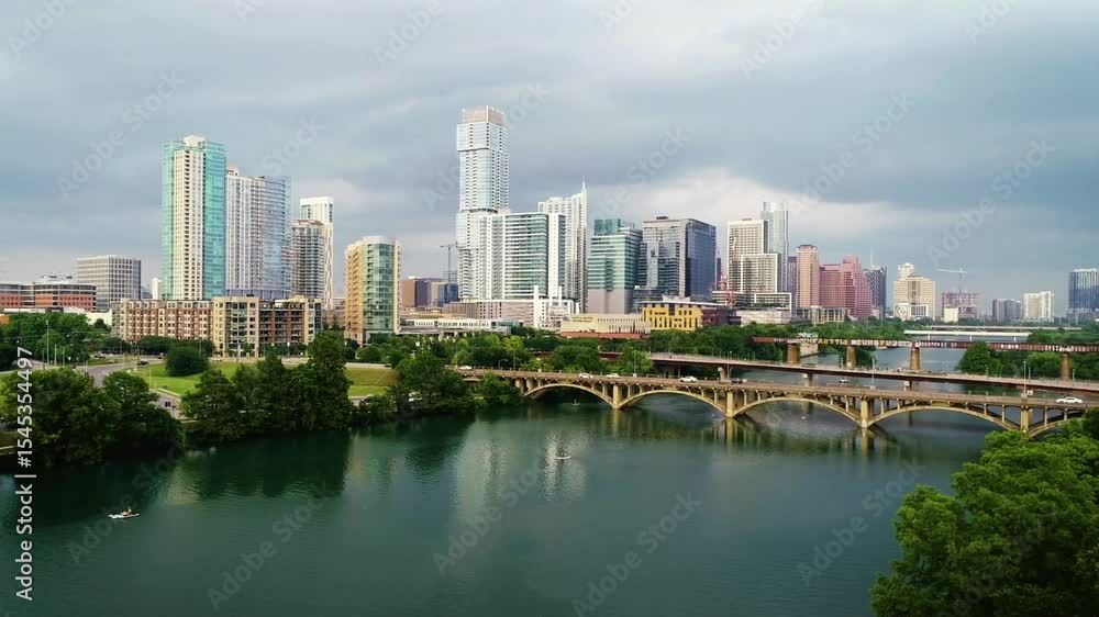 Austin, Texas Skyline with River and Bridges on an Overcast Day Austin, Texas Skyline with River and Bridges on an Overcast Day
