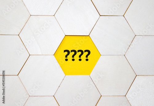 Question marks symbol. Concept words question mark on wooden comb puzzle. Beautiful yellow background with succulent plant. Business and question mark. Copy space.