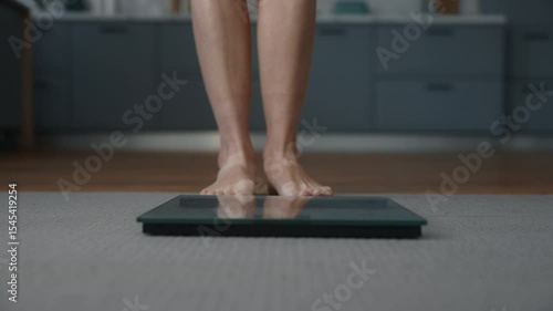 Female feet on scale showcasing anorexic body weight