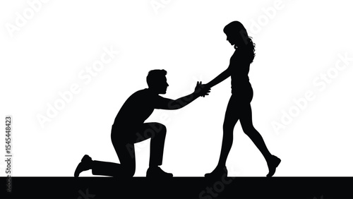 Man on his knees holding a woman's hands and asking her to marry him, silhouette of a couple
