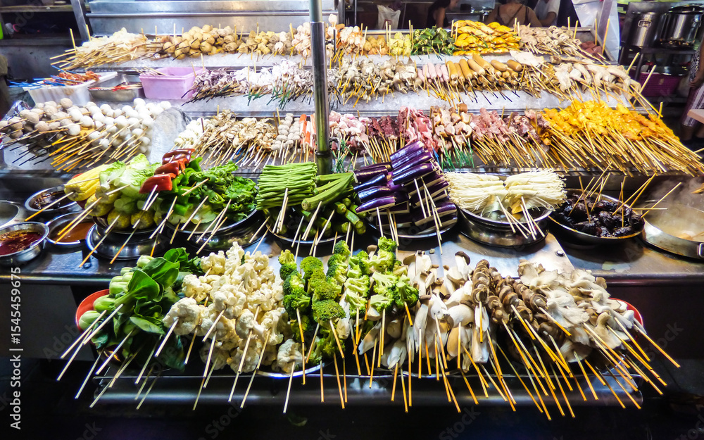 Fototapeta premium Grilled vegetables and meat at Alor Street Food Night Market in Kuala Lumpur, Malaysia