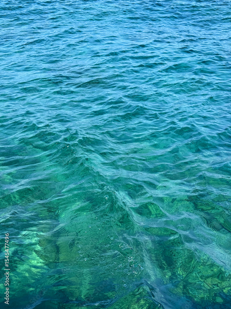 Obraz premium Blue turquoise sea waves surface.