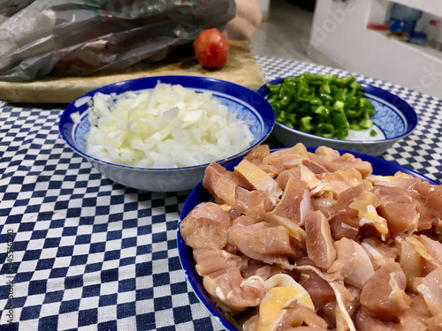 Raw Chicken, Chopped Onion, Green Peppers and Garlic