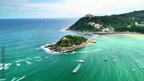 Aerial shot of a stunning coastal area with a picturesque island, lush greenery, and tranquil waters