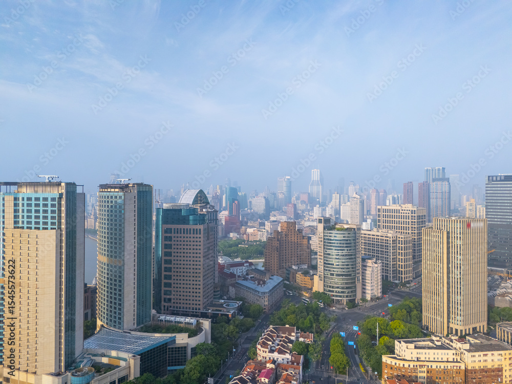 Obraz premium Aerial view of Shanghai skyscrapers and residential buildings in downtown.
