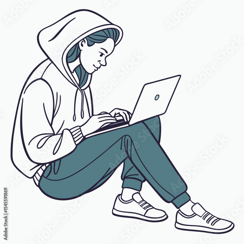 Young woman in hoodie using laptop computer while sitting on floor