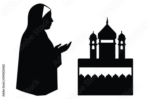 Silhouette of a hijabi woman praying near the kaaba