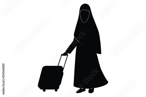 Woman in burqa walking with luggage at airport