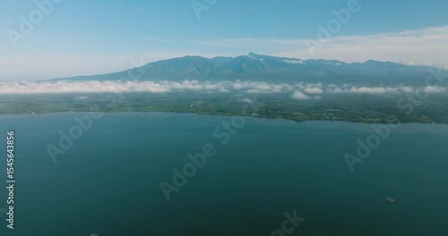 Wallpaper Mural Tropical Island with blue sea and cloudscape over the mountain. Lanao del Norte. Mindanao, Philippines. Torontodigital.ca