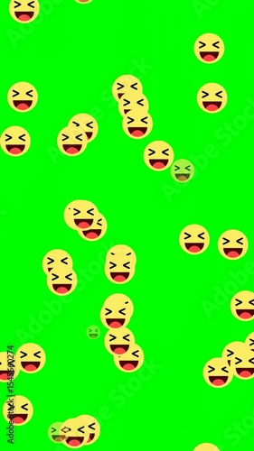 Social media Animation flying laugh emoji particles on green background, social media emotiocon reaction. Vertical
