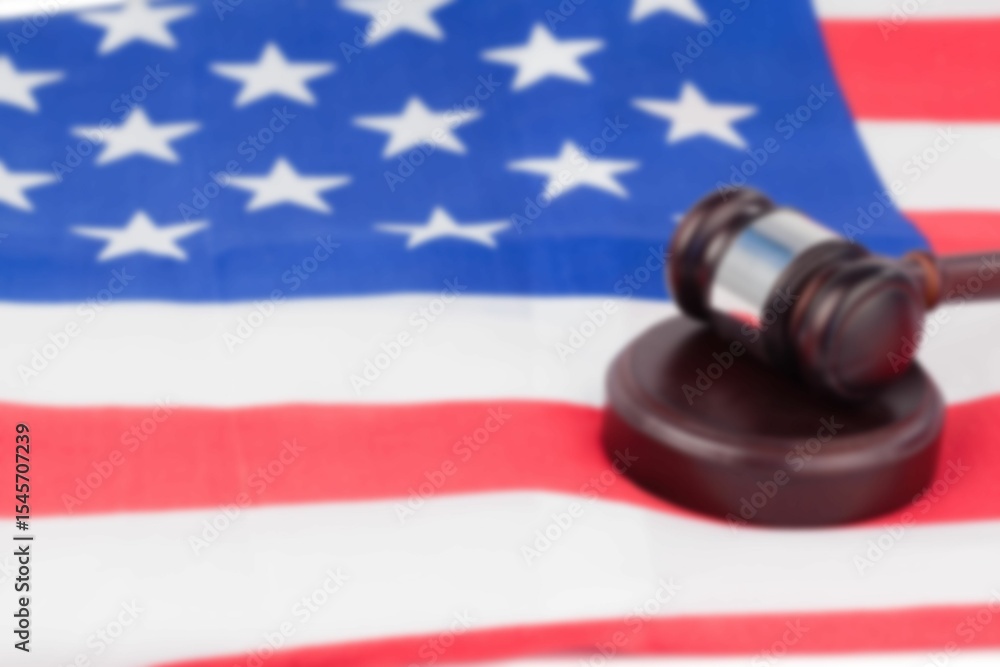 Naklejka premium Close-up of gavel on flag