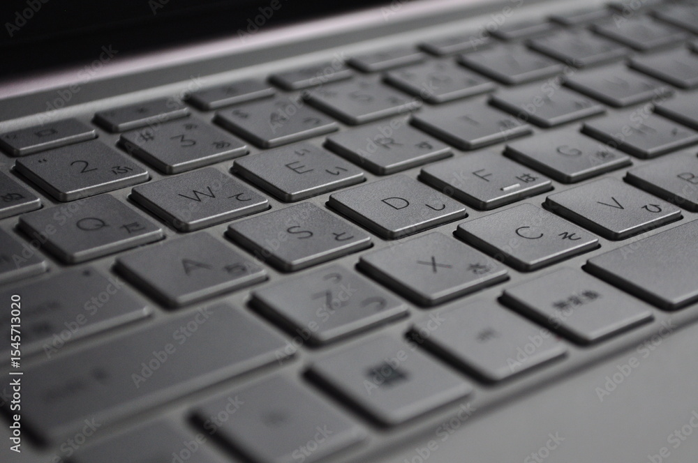 Laptop Keyboard with Japanese Hiragana and Latin Characters, Gray Keyboard in Shallow Depth of Field Laptop Keyboard with Japanese Hiragana and Latin Characters, Gray Keyboard in Shallow Depth of Field
