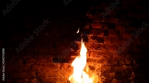 Fire burns in the darkness, fire in the fireplace