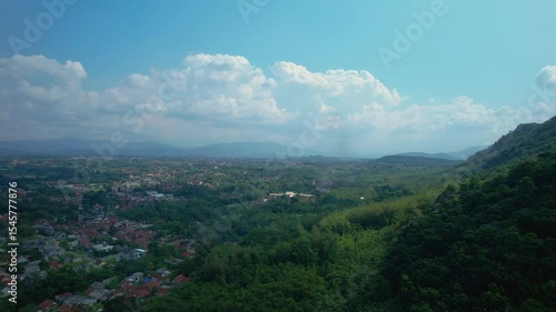 Aerial View from Drone of the Hilly Suburban in Indonesia as Mountainous Landscape as Background