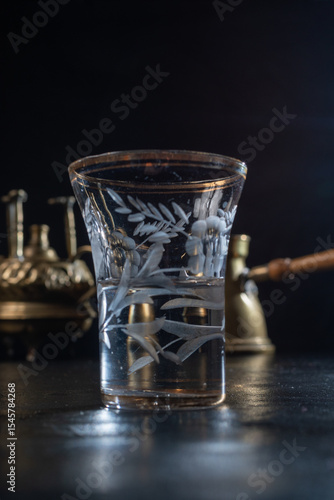 фотографія Small glass filled with anise-flavored drink, capturing the essence of traditional taste, herbal aroma, and cultural rituals in a minimal and elegant presentation