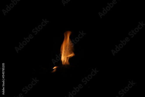 Fire flames on black background. Closeup of fire flames isolated on black background