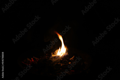 Fire flames on black background. Closeup of fire flames isolated on black background
