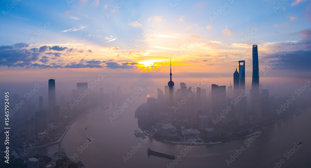 Fototapeta premium Aerial view of Shanghai skyline in downtown at sunrise.