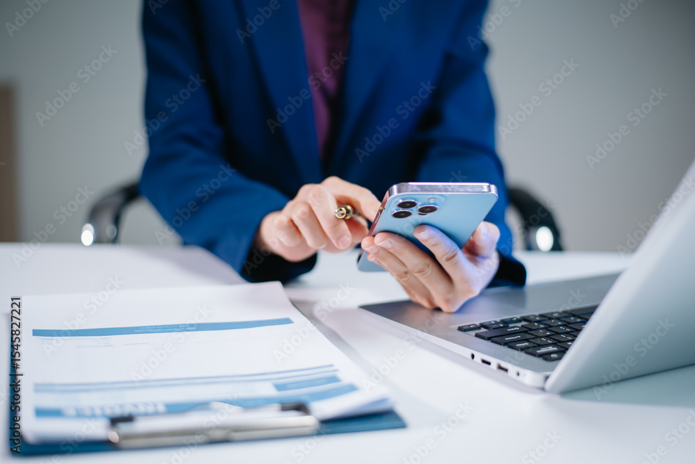 Fototapeta premium usiness woman sitting front tablet ,laptop computer with financial graphs and statistics