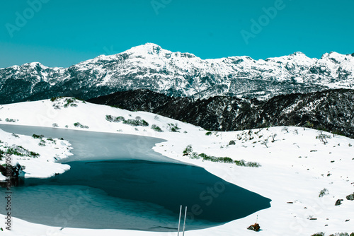 lake in snow covered mountains