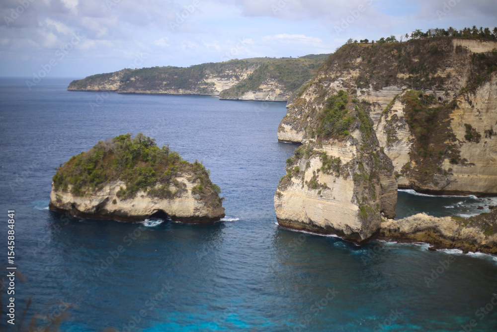 Scattered Rocky Islands and Towering Cliffs in the Deep Blue Ocean Scattered Rocky Islands and Towering Cliffs in the Deep Blue Ocean