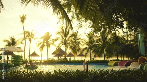 Enjoy a serene sunset at this beautiful tropical poolside retreat, a perfect getaway