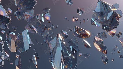 Iridescent shattered crystals falling against a gray background. Suitable for designs needing elegance, glamour, or a mystical touch.