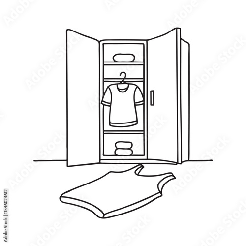 A wrinkled undershirt resting under a closet on the floor