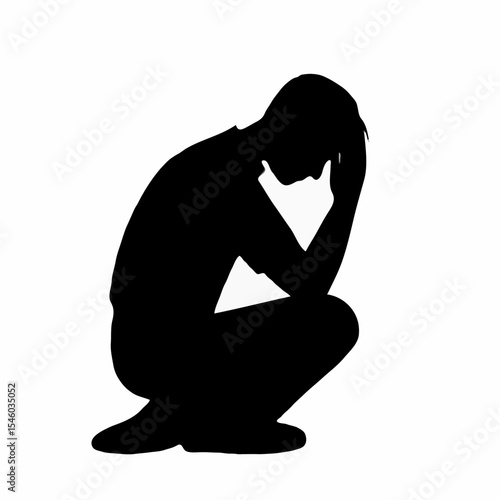 Man sitting in a crouched position with head in hands  