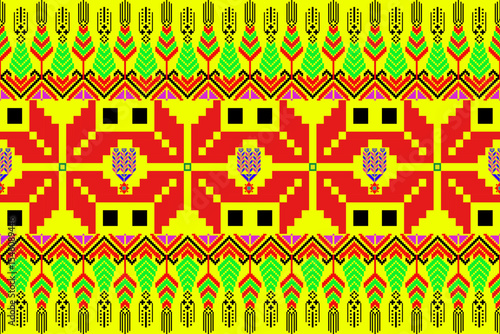  Vibrant pixel textile inspired by northeastern Thai (Isan) weaving traditions. The bold central sunburst motif radiates out in pixelated zigzag waves, using yellow, red, black, and electric blue. A f